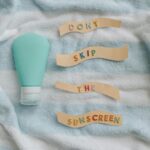 Promote skin health with a reminder to apply sunscreen daily from a flat lay photo.